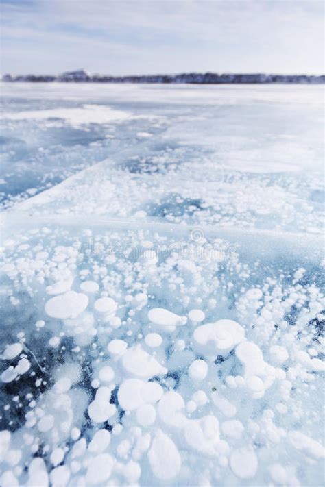 Bubbles In Ice Of Baikal Lake Winter Texture Stock Photo