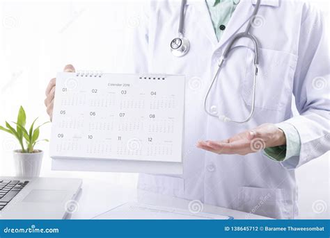 Doctor Hand Holding Calendar Appointment For Patient Concept Planner