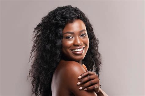 Premium Photo Portrait Of Nude Beautiful Afro Woman Smiling Over Grey