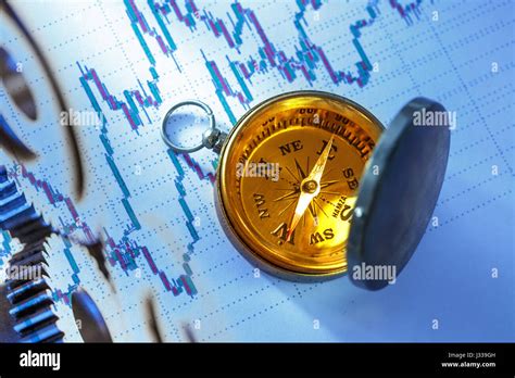 Compass On Stock Market Data Chart In Closeup Stock Photo Alamy