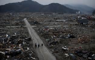 Japan tsunami, before & after: Japan earthquake and tsunami: Man sifts through office ...