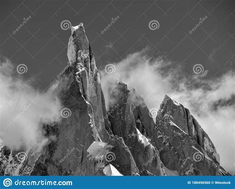Grayscale Shot Of The Cerro Torre Sharp Mountain Tops Covered In Snow