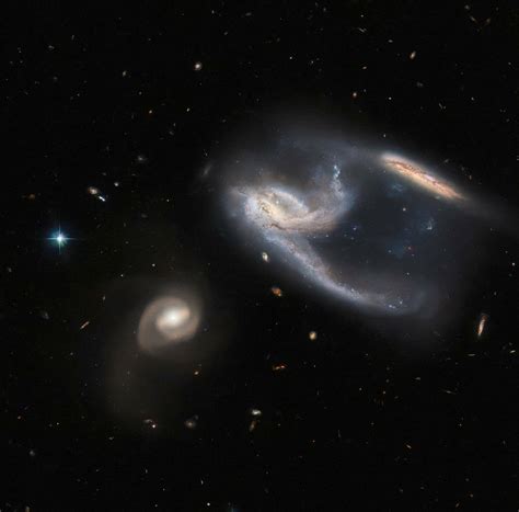 Nasas Hubble Delivers Stunning View Of Three Galaxies In A Single Image
