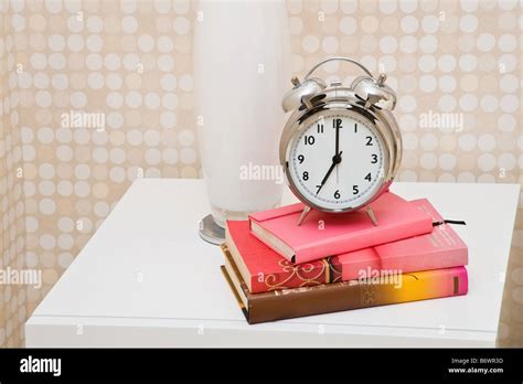 Alarm Clock On Bedside Table Stock Photo Alamy