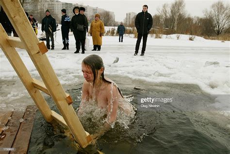 A Russian Girl Submerges Himself In The Cold Water During A Ceremony