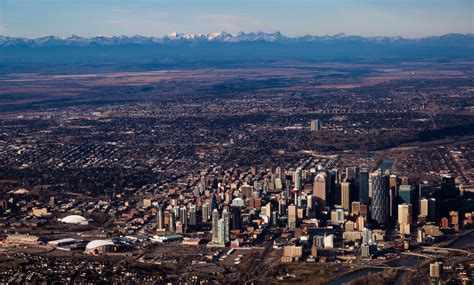 Aerial View Of Downtown Calgary And The Rockies Skyrisecalgary