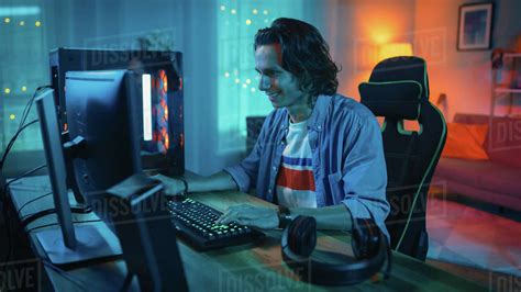 Excited Gamer Playing Online Video Game On His Personal