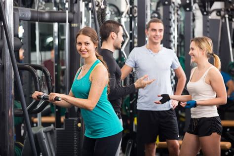 Young Adults Working Out In Fitness Club Stock Photo Image Of