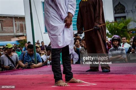 Indonesian Gay Couple Sentenced To Public Caning In Aceh Photos Et