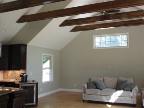 Exposed ceiling beams can immediately add warmth and charm to any dull room. Vaulted ceiling exposed beams