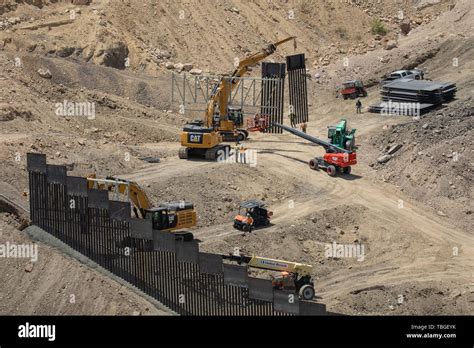 Workers Assemble A Section Of Border Fence Near El Paso Texas Part Of