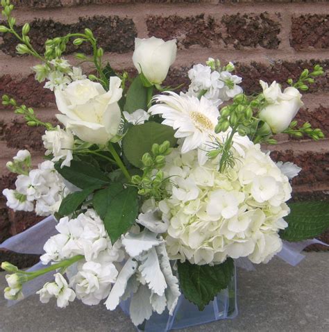 White Hydrangea Roses Larkspur Stock Gerber Daisy And Orchids Along