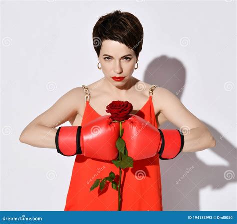Beautiful And Strong Short Haired Brunette Woman With In Red Dress