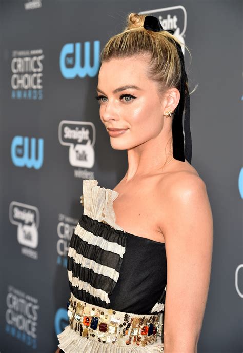 Margot Robbie Dominates With A Pretty Hair Ribbon And Top Knot At The