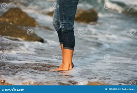 Woman Bare Foot Walking On The Beach Between Rocks Stock Image Image