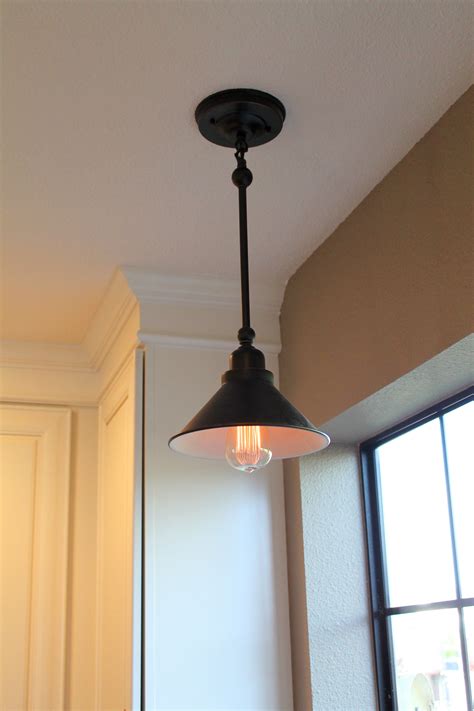 Kitchen In Capitola Oil Rubbed Bronze Light Fixture With An Old Fashioned Light Bulb Azulejos