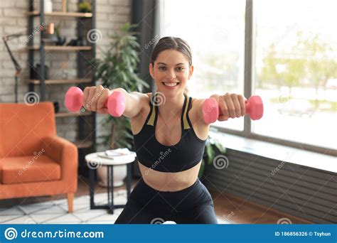 Beautiful Slim Fitness Woman Crouches With Dumbbells Sport Healthy