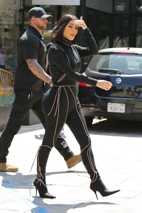 Kim Kardashian Dons Black Form Fitting Jumpsuit While Out To Lunch At Cafe Gratitude In Los