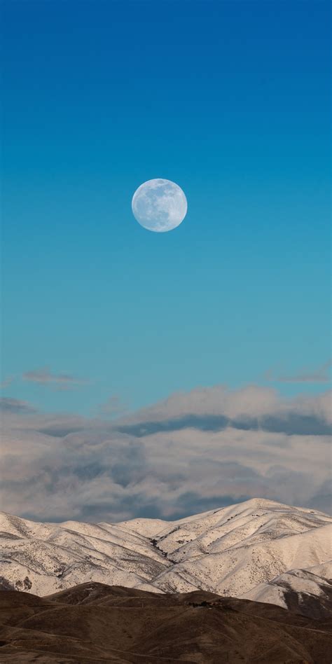 Download Wallpaper 1080x2160 Moon Blue Sky Landscape Hills Clouds