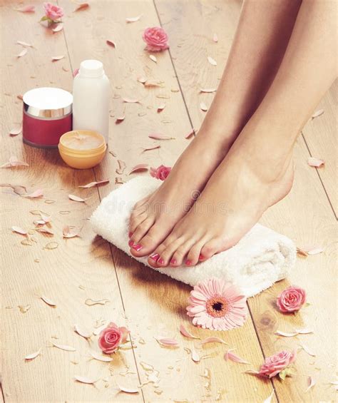 Spa Background With Beautiful Feet Flowers And Petals Stock Photo