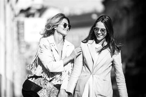 Premium Photo Young Women Talking And Laughing In The Street Girls