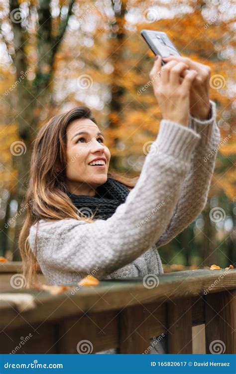 Beautiful Young Happy Woman Taking Selfie With Smartphone In Autumn Park Season Technology And