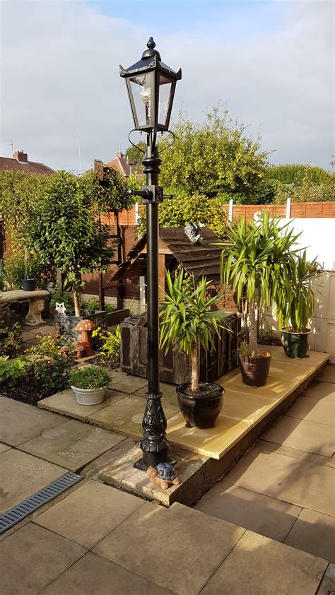 A 2.7 metre tall black Victorian lamp post installed on an outdoor