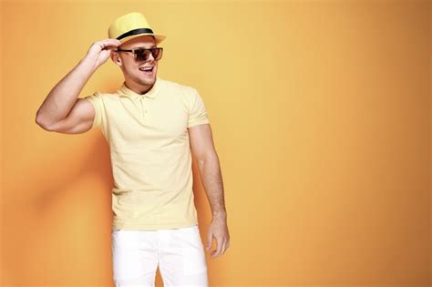Premium Photo Confident Stylish Guy In Yellow Shirt Sunglasses