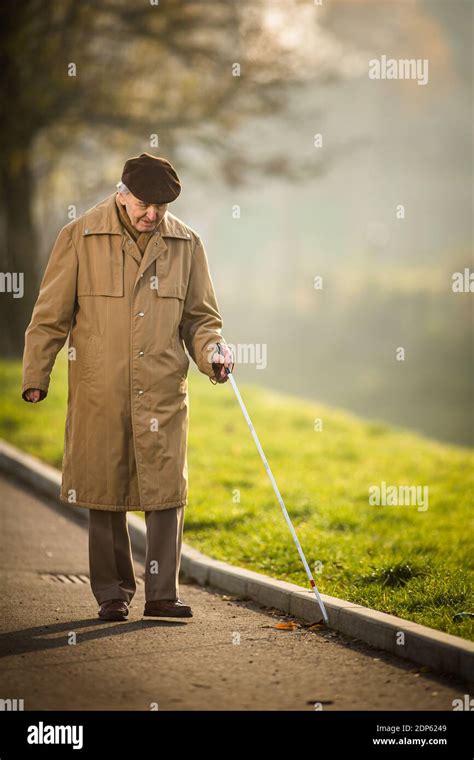 Blind Man Crossing A Street Stock Photo Alamy