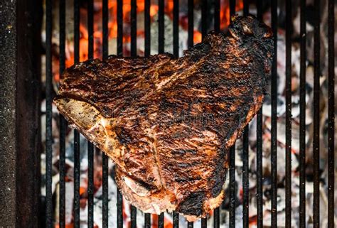 How do you know when the coals are ready? Grilling Big T-bone Steak On Natural Charcoal Barbecue Grill. Stock Image - Image of grilling ...