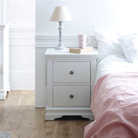 This bedside table is upholstered in white faux leather all the way buy it. White Bedside Table - Newbury White Range