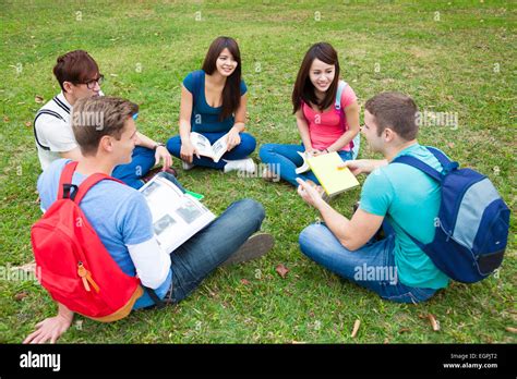 College Students Studying And Discuss Together In Campus Stock Photo