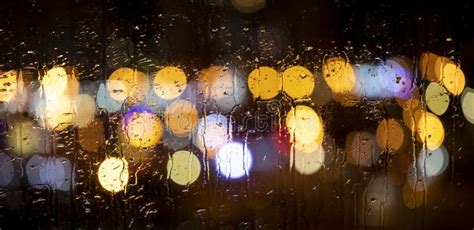 Rain Drops On Window With Road Light Bokeh Stock Photo Image Of Glass