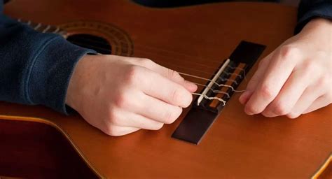 How To Restring A Guitar The Right Way Thestudiogenie