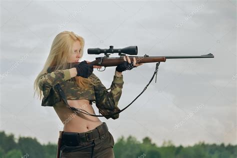 Pretty Hunter Girl Aiming With Hunting Rifle In The Outer Wood Stock