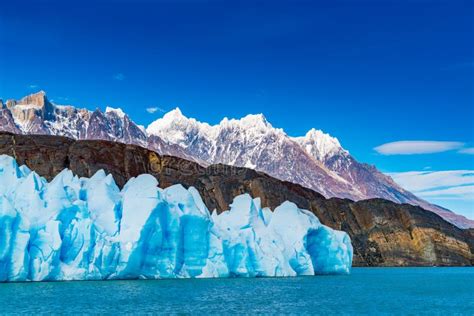 Blue Iceberg Of Grey Glacier The Ripples Of Grey Lake And The