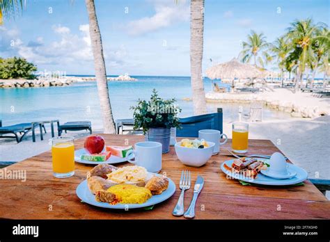 Breakfast On A Table By The Beach Looking Out Over The Ocean Caribbean