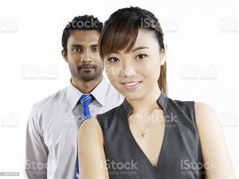 Two Business People Standing And Smiling Stock Photo Download Image