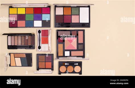 Creative Layout Of Vibrant Make Up Palettes On Nude Background Stop