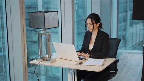 Portrait Of Business Woman Working At The Table In A Modern Office