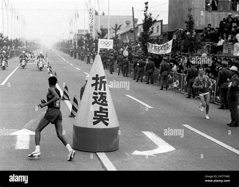 Abebe Bikila Of Ethiopia L Competes During The Marathon In Tokyo