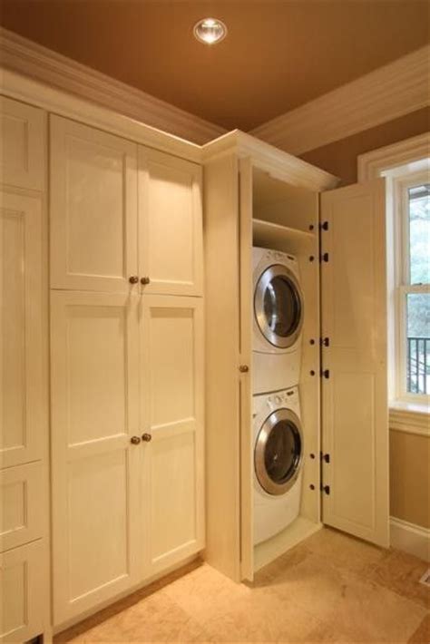 We selected a unit that uses a. hidden washers and dryers by Gillie | Laundry room storage ...