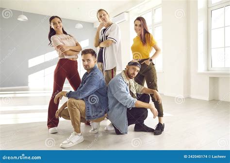Young Hip Hop Dance Crew Members In Casual Clothes Posing In Their