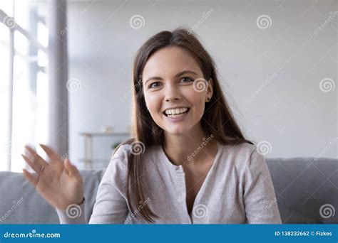 Happy Teen Girl Waving Hand Saying Hello Looking At Webcam Stock Photo