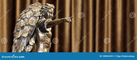 Statuette Of Archangel Michael With Wings And Sword Stock Photo