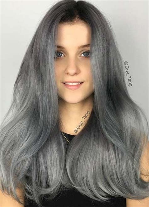 A Woman With Long Grey Hair Is Shown In The Instagramture On Her Phone