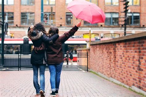 To cancel your over 55's life cover call us on 0370 010 40 80. women walking in the rain - Lifewise