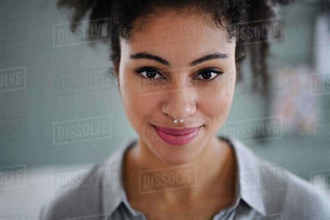 Close Up Front View Portrait Of Beautiful Young Woman Indoors Looking