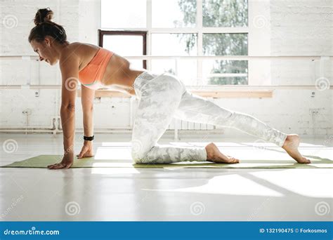 Fitness Strong Woman Bending Forward Stretching Her Leg Sitting On Yoga Mat Stock Image Image