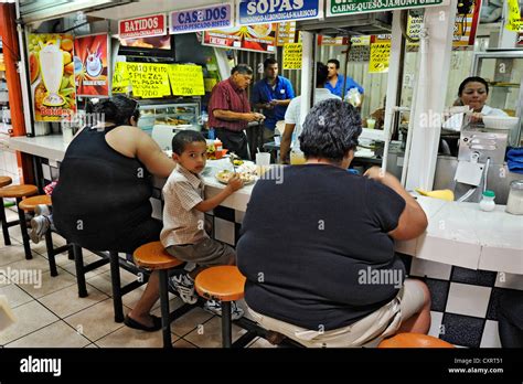 Obese women fast food restaurant at the Central Market San José